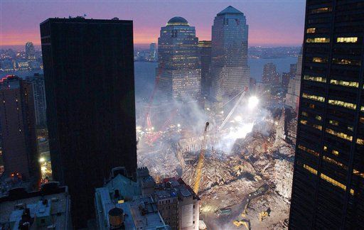 The black tower, left, is the vacant Deutsche Bank. (AP Photo/Mark Lennihan, File). NEW YORK (AP) — The contaminated bank tower stood shrouded in black 
