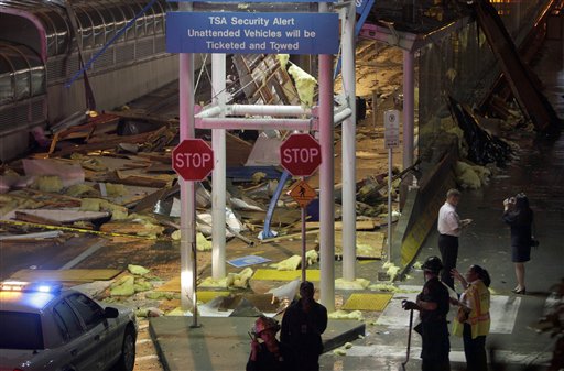 tornado damage st. louis airport. 2011. Crews survey damage