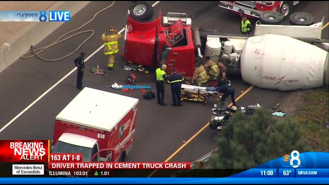 Cement truck crashes on freeway connector, trapping driver - CBS News 8